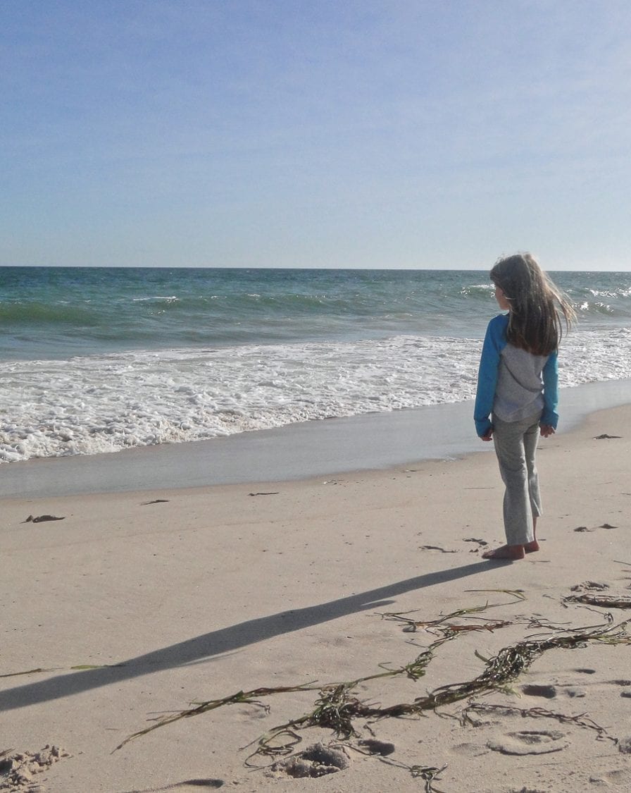 beach walk with kids watching waves