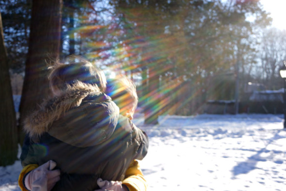 twins hugging sunlight rays