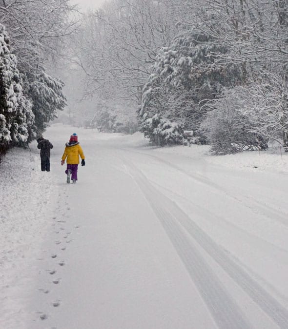 walking snow covered road