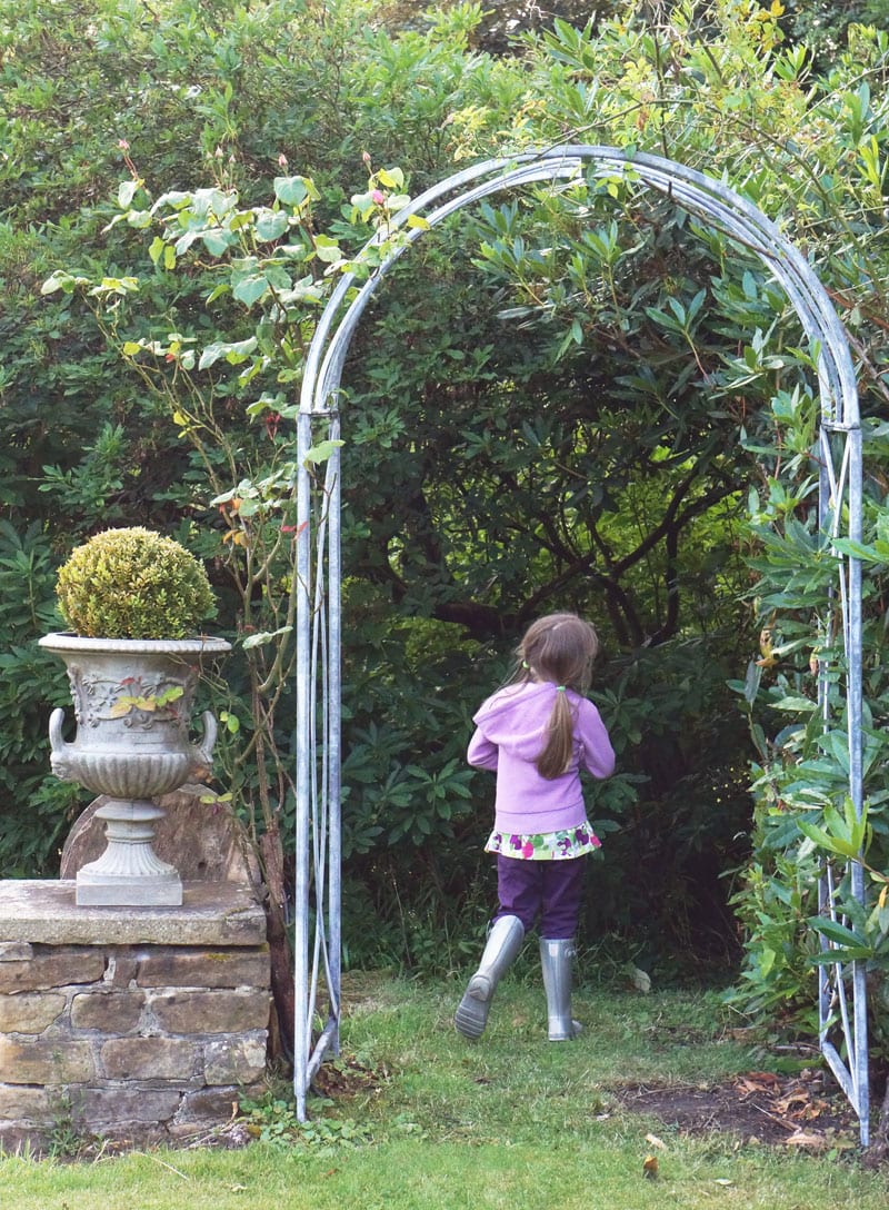 rose covered arch and urn