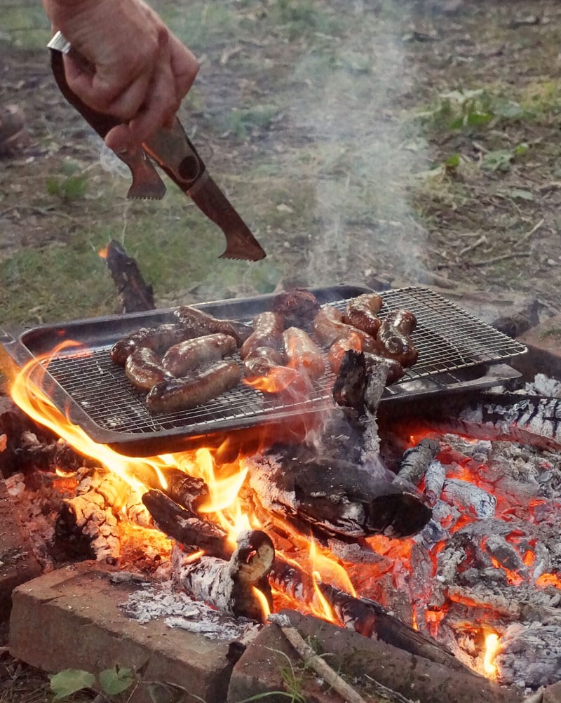 tongs picking sausages