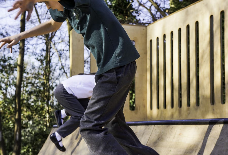 Luce and Theo on skateboard slide