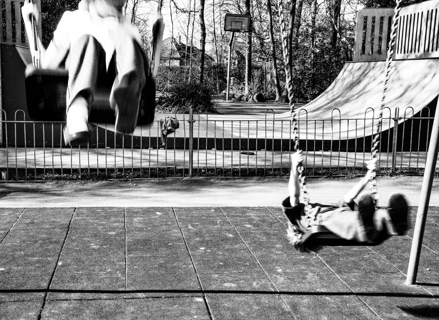 Luce and Theo on swings
