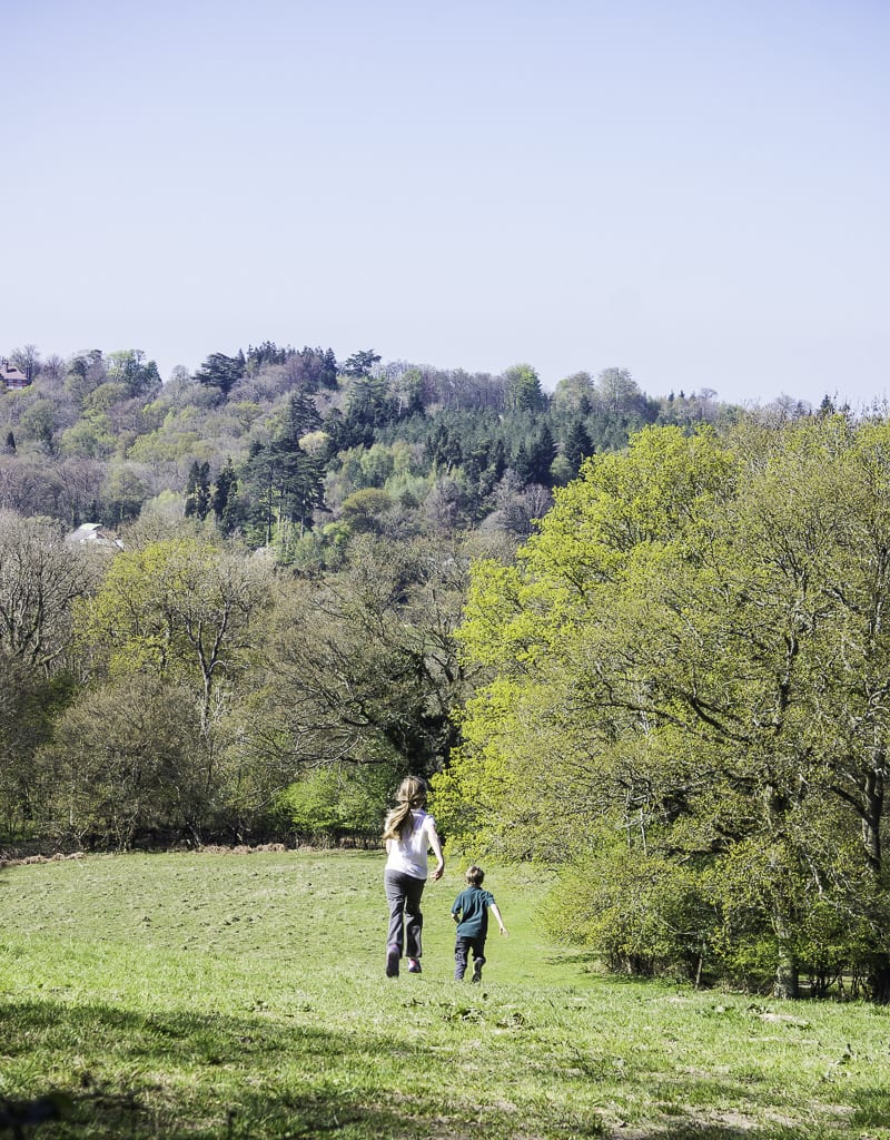 children running down hill on nature walk