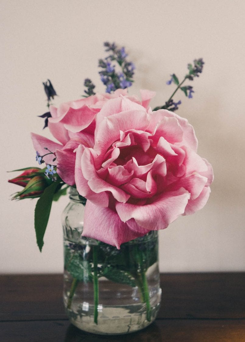 Celebration vase roses and wild flowers