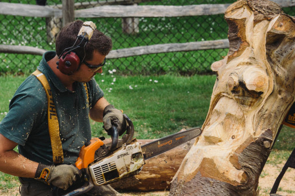 Chainsaw sculptor at village fair