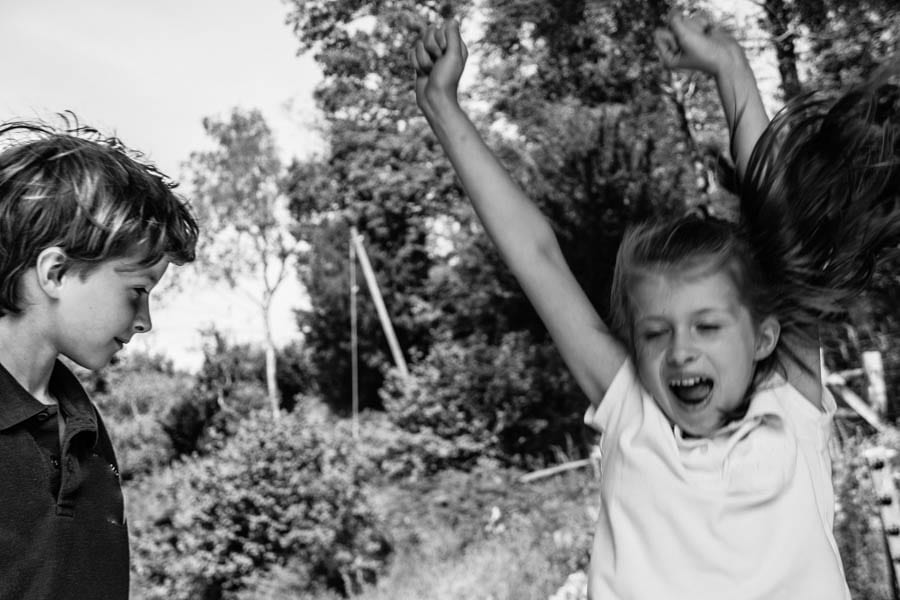 Luce and Theo laughing and dancing joyfully