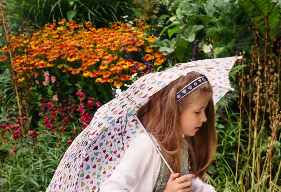 Luce with umbrella in Gravety Garden