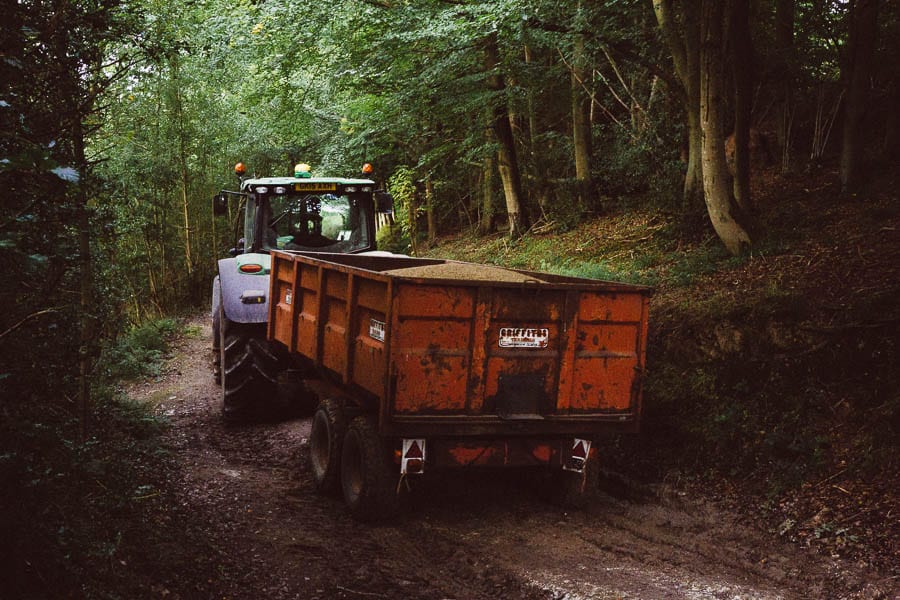Tractor with grain in woods