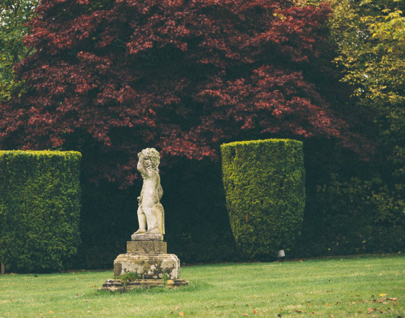 Groombridge Place formal gardens with statue