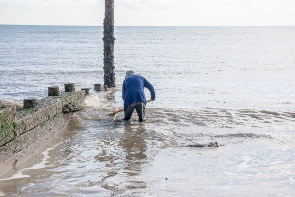 Shrimping at Kingsdown Kent dragging net in water