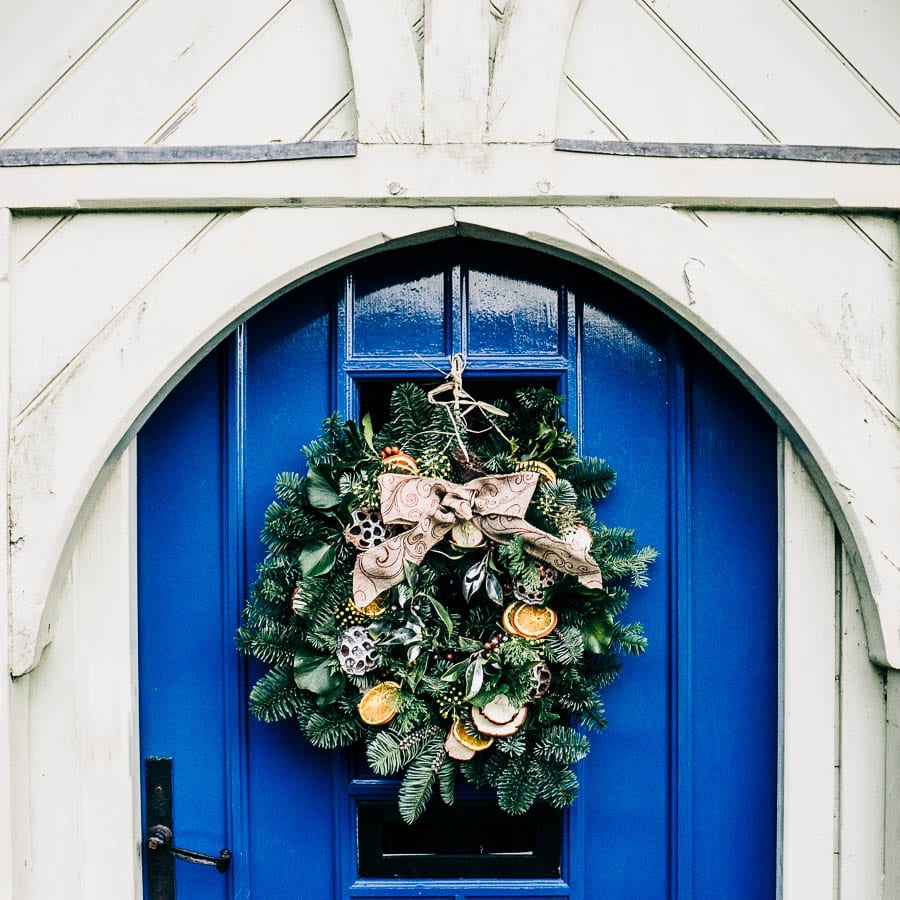 Christmas wreath on blue front door
