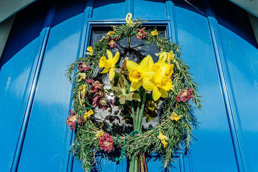 Spring wreath on door with daffodils