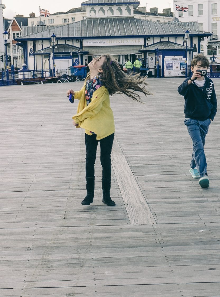 Twins at the pier with cameras