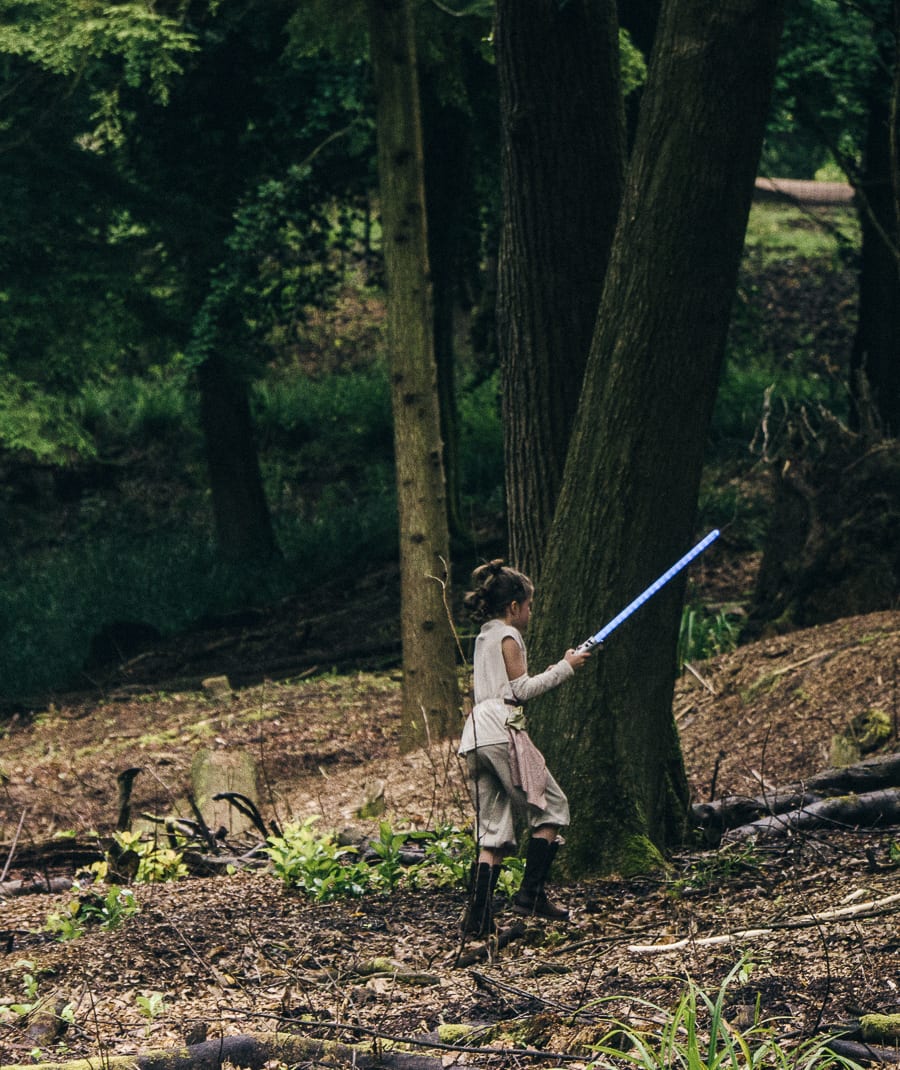 Lightsaber battle in woods Rey