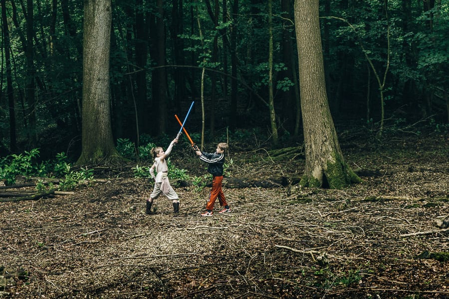 Lightsaber battle in woods kids clash