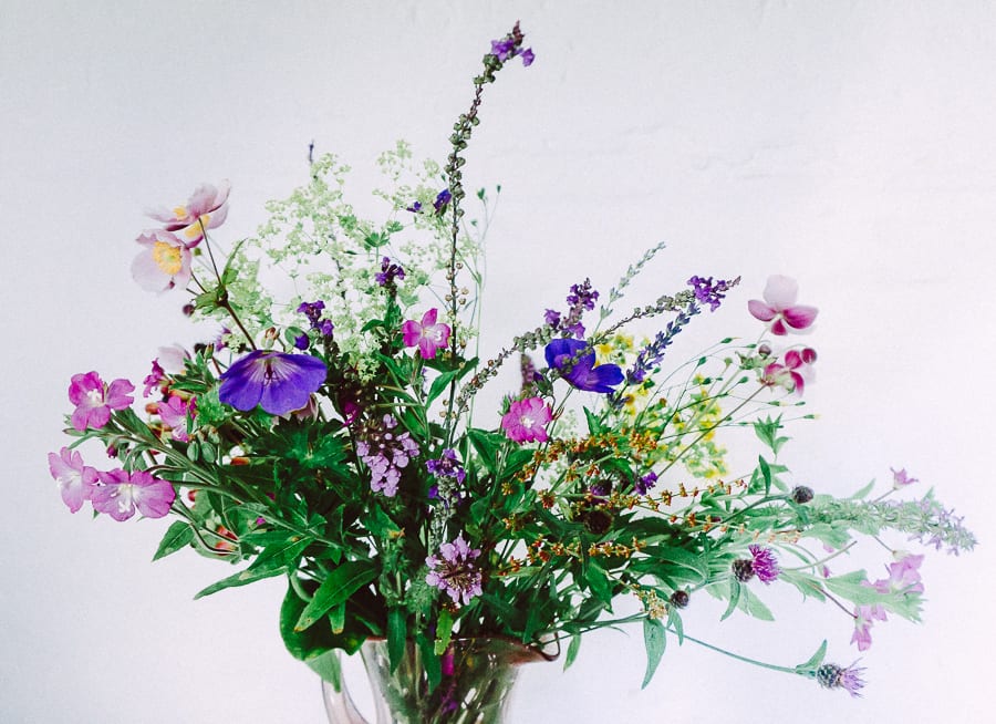 Vase wild and garden flowers